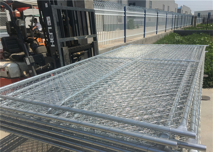 temporary chain link fence loaded into container by fork lift